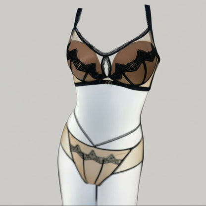 Black lace lingerie set on a mannequin against a neutral background