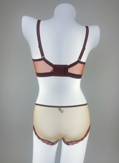 Mannequin wearing a brown bra and underwear set on a plain background